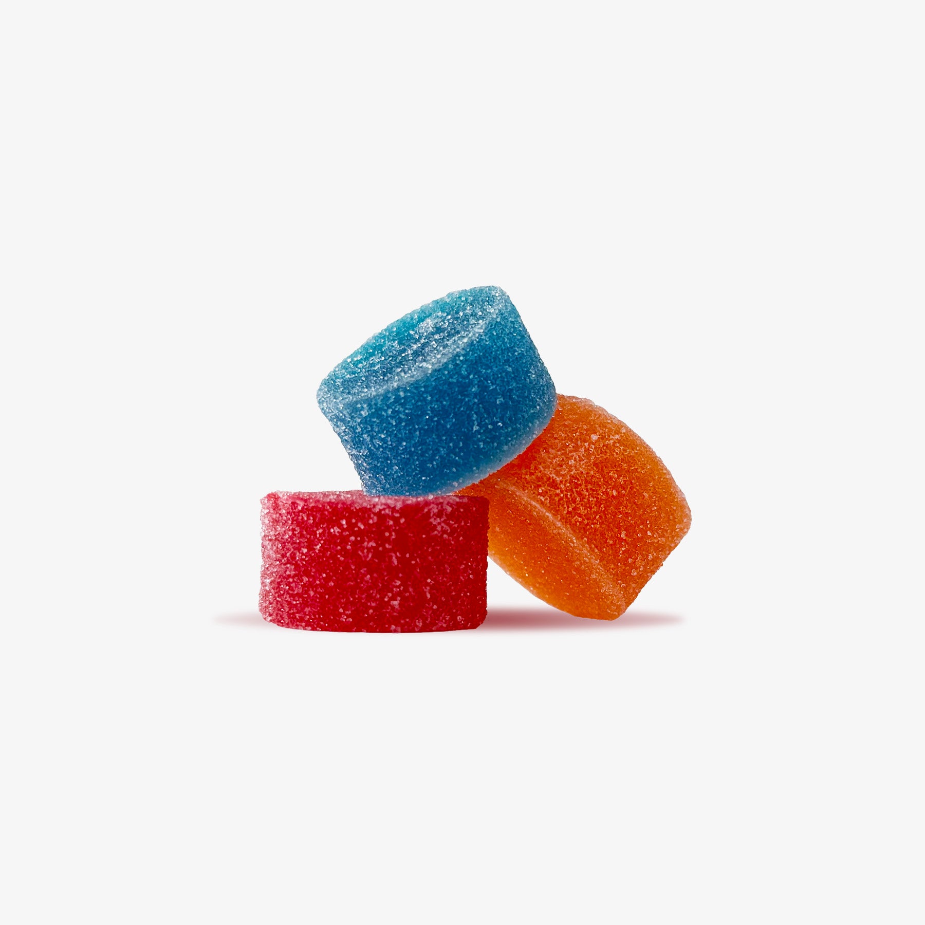 Three colorful gummy candies on a white background