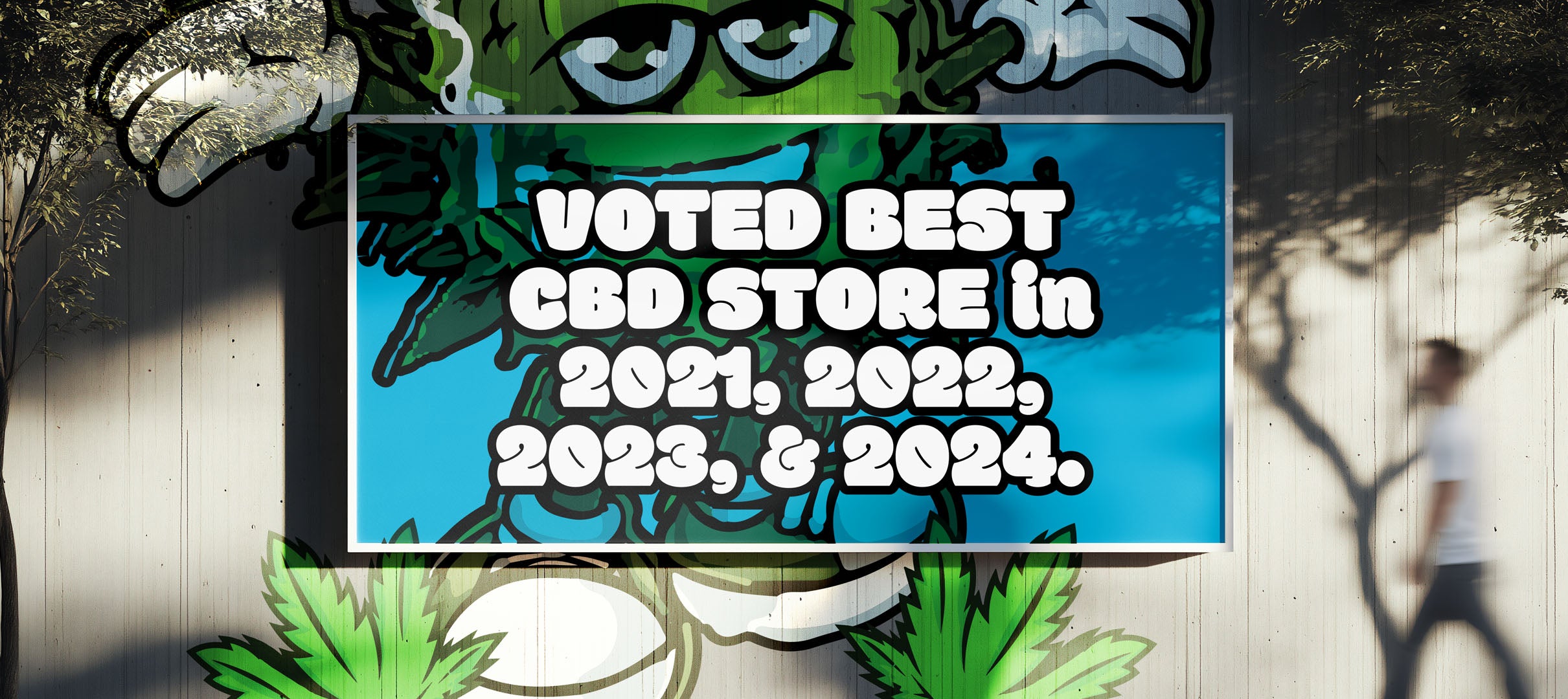 Signboard with text 'Voted Best CBD Store in 2021, 2022, 2023, & 2024' on a wall.